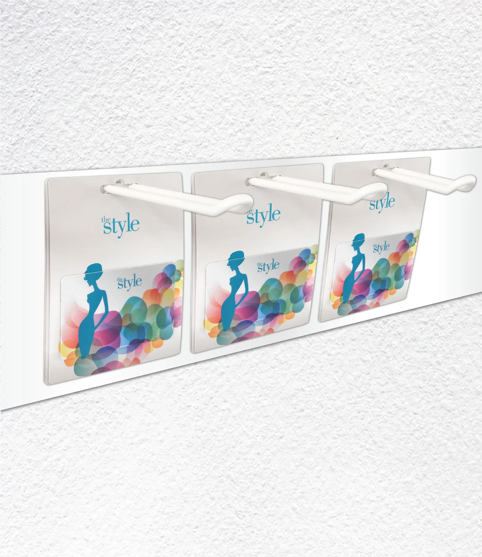 Gift cards on a display hanger for sale in a shop