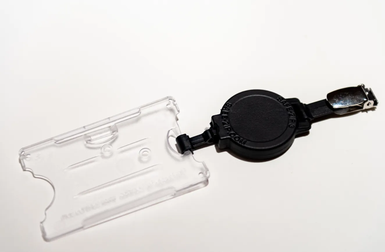 Badge reel with belt clip and card holder